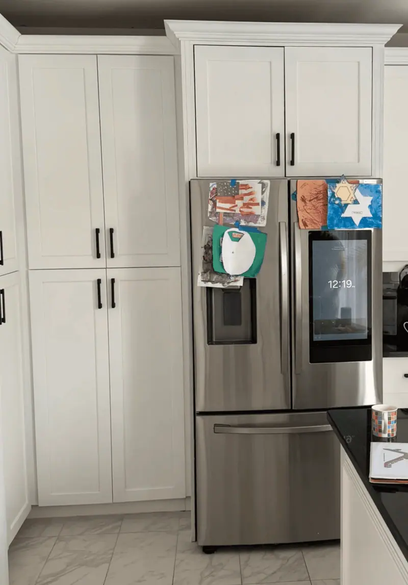 After: white cabinetry surrounding the refrigerator, Hallandale Beach