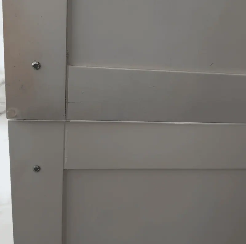 Close-up of the smooth, stain-free finish on refinished cabinet doors