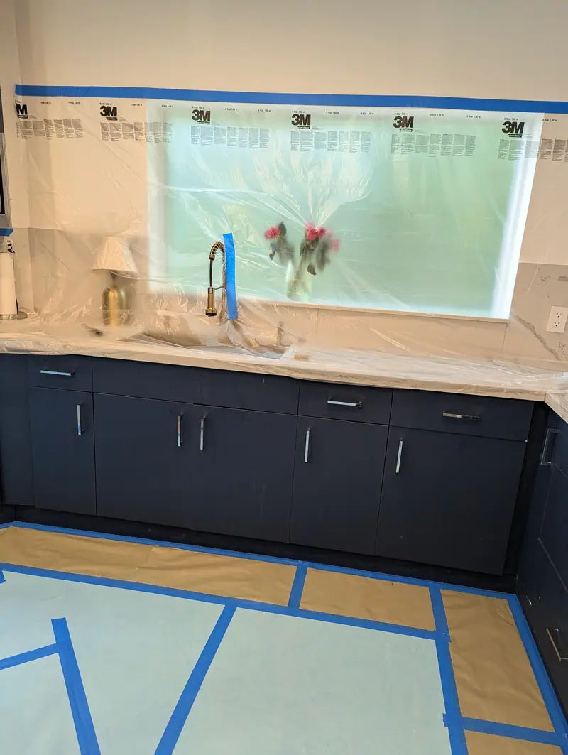 Navy cabinets by the kitchen window before refinishing, Fort Lauderdale