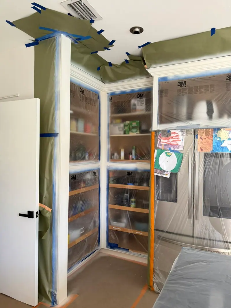 Pantry cabinets opened and masked during refinishing, Hallandale Beach